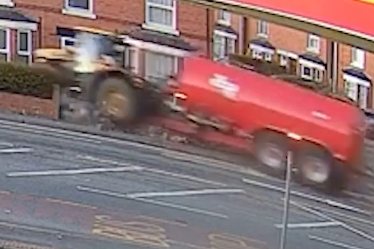 Moment tractor smashes into homes after drug driver runs red light