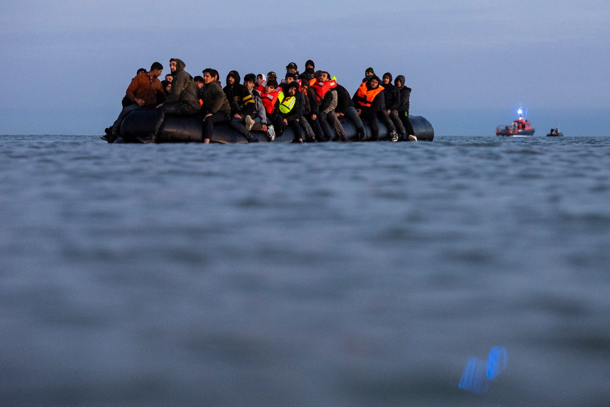 Family of three become first asylum seekers to arrive in UK as part of ‘one in, one out’ deal with France