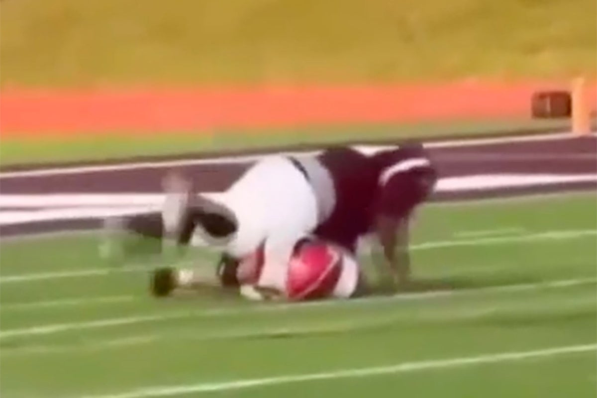 High school football player left with broken spine as opponent jumps on him in unsportsmanlike move
