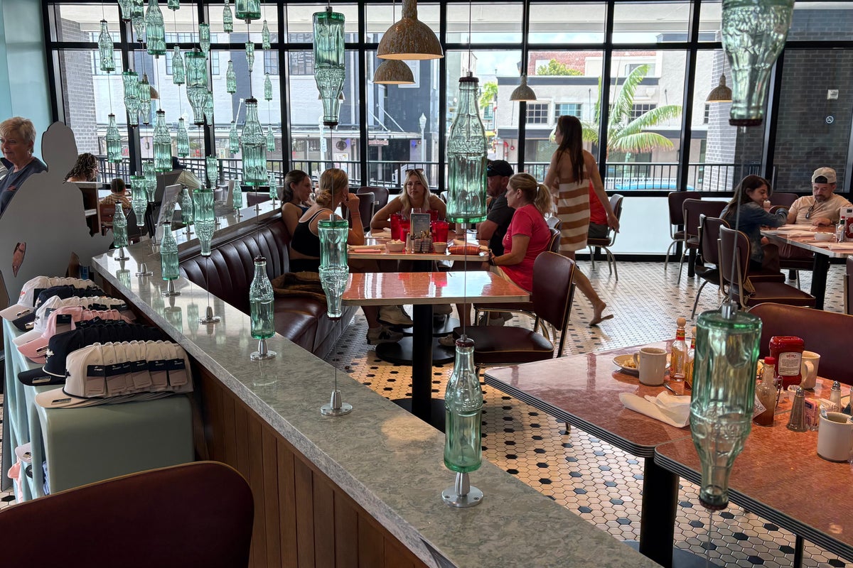 Hero waiter foils potential bloodbath after overhearing customers talk about shooting up nearby bank: police