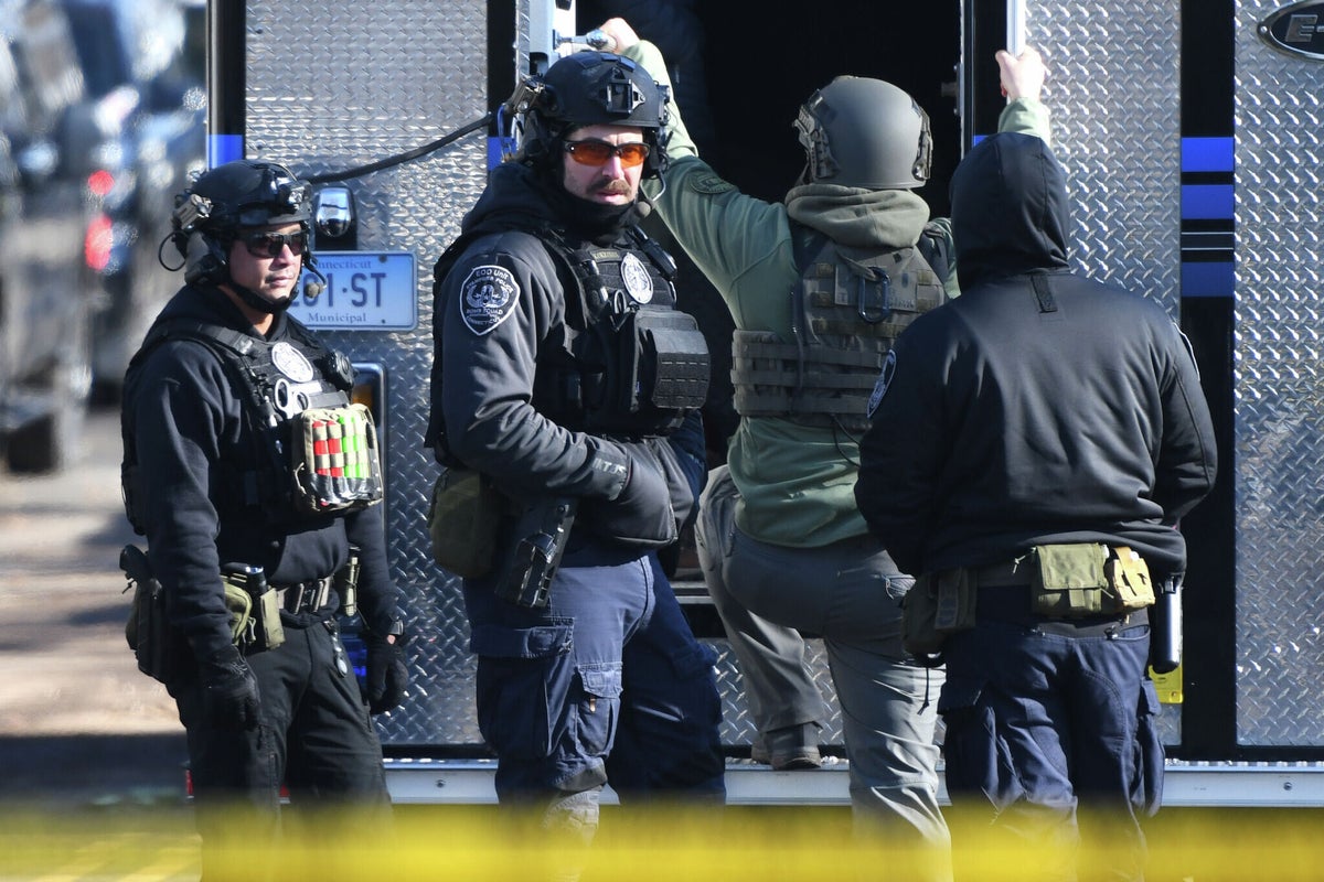 Police find decomposed body and pipe bombs after standoff with man who shot at officers